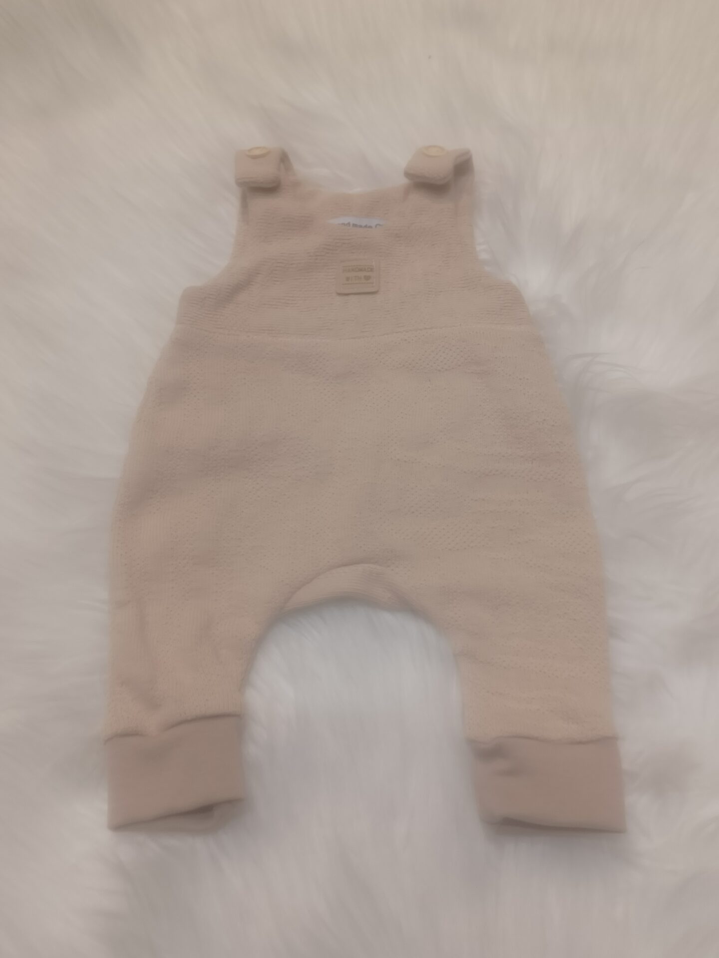 Strampler Strick beige mit Bündchen